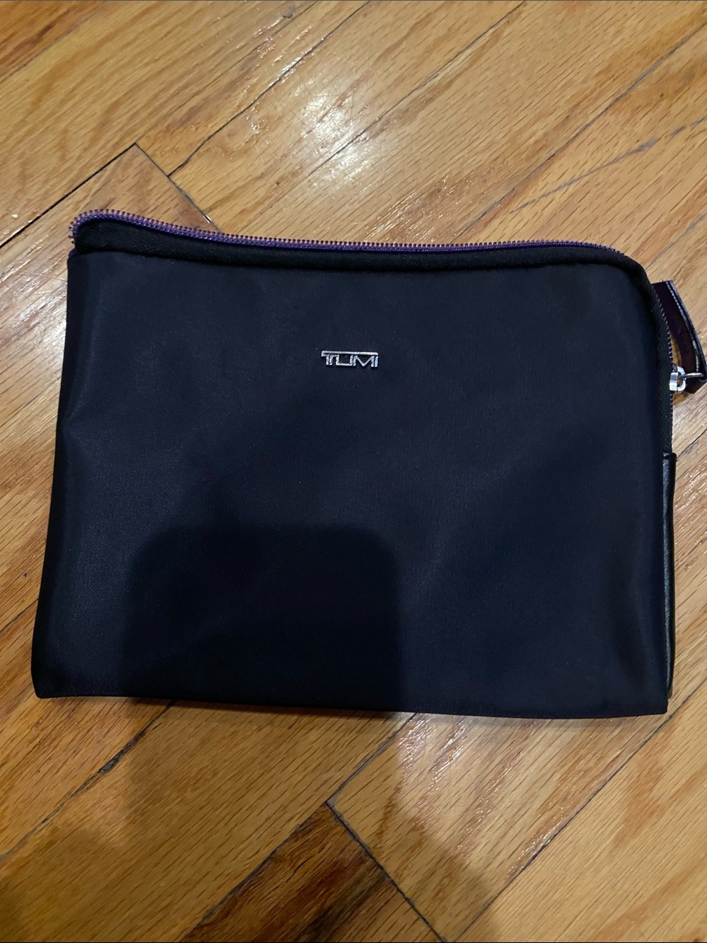 Tumi Black Toiletry Pouch with Purple Zipper Trim